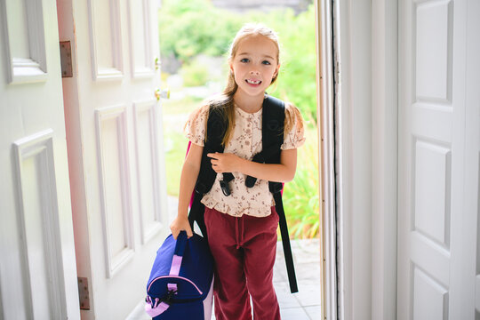 Adorable five year old girl ready for first day of school