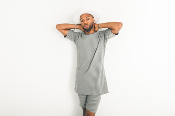 Portrait of black fashion American wearing great looking clothes with white hat