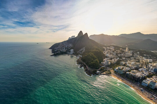 Aerial View of Leblon Beach and Two Brothers Mountain in Rio de Janeiro on Sunset - Powered by Adobe