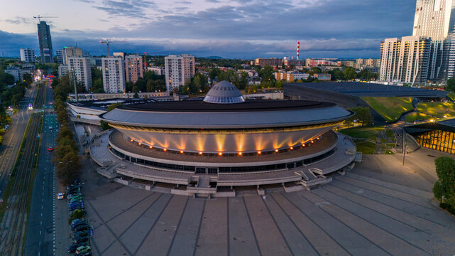 Katowice, Poland - September 6, 2025: Aerial rotate view Spodek sports and entertainment hall in the evening.