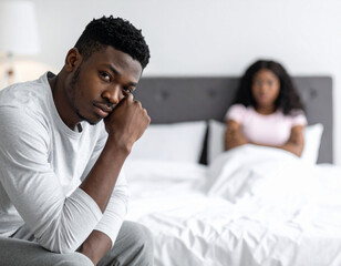 African American black man face looking sad with wife after arguing about erectile dysfunction during stressed argument with wife