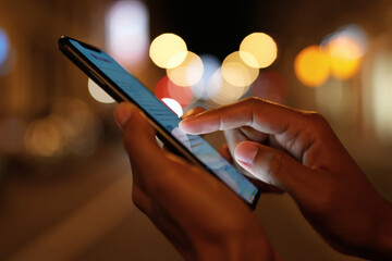 A closeup of a person's hands holding a tablet computer