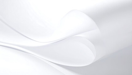 Obraz premium Smooth, flowing curves of white paper create a serene and minimalist design.