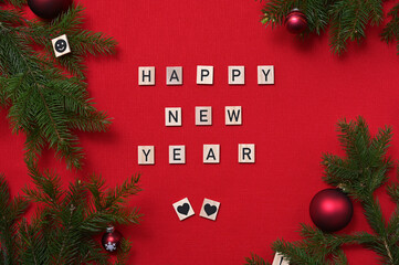 inscription Happy New Year framed by fir branches and Christmas balls