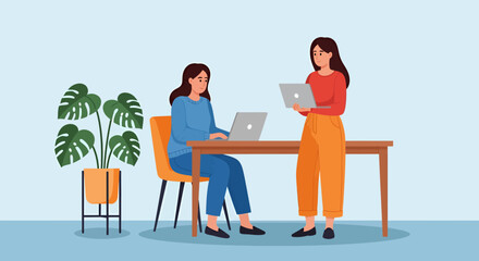 Two women working on laptops at a desk with a potted monstera plant.