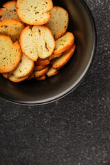 Crisps croutons with greens croutons delicious snack fresh delicious gourmet food background on the...