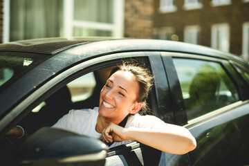 woman at car window drive a new car