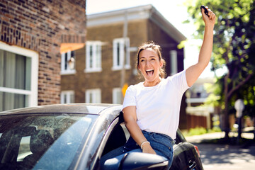 woman at car window drive a new car