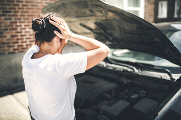 woman at car window drive a new car very sad about car problem