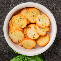 Crisps croutons with greens croutons delicious snack fresh delicious gourmet food background on the...