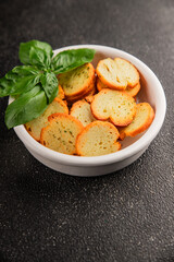 Crisps croutons with greens croutons delicious snack fresh delicious gourmet food background on the...