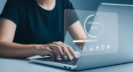 Person updating software on laptop with progress bar and icons