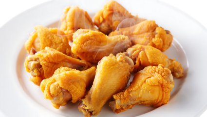 A generous serving of goldenbrown fried chicken wings on a white plate isolated on transparent background, perfect for showcasing the crispy texture and savory flavor of this classic comfort food