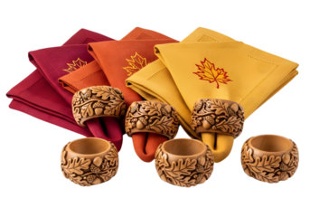 Festive fall napkins with embroidered maple leaves and wooden acorn napkin rings create a warm ambiance isolated on transparent background