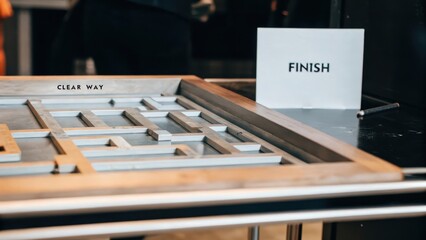 Wooden Maze Game in Modern Setting with Clear Way and Finish Sign