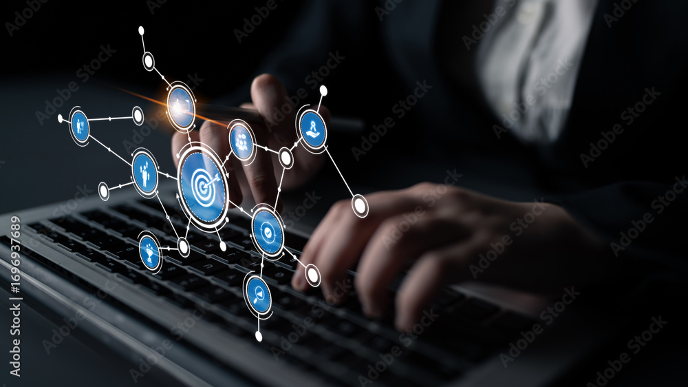 Poster a professional uses a laptop to engage with advanced digital tools, enhancing data analysis and deci