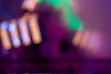 Colorful lights create a vibrant atmosphere at night festival in a bustling city