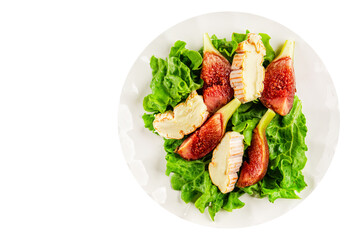 Salad figs, soft cheese, green leaf lettuce tasty snack fresh delicious gourmet food background on the table rustic food top view copy space keto and paleo diet vegetarian food