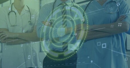 Standing medical team in uniforms, crossing arms at clinic, with stethoscopes and digital overlay