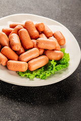 Mini sausages fresh delicious processed meat tasty snack fresh delicious gourmet food background on the table rustic food top view copy space