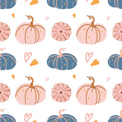 Seamless autumn pattern with hand drawn pink and blue pumpkins and hearts on white background. Cute cozy autumn background design. Decorative pumpkins. Pastel colors. Vector illustration. Halloween