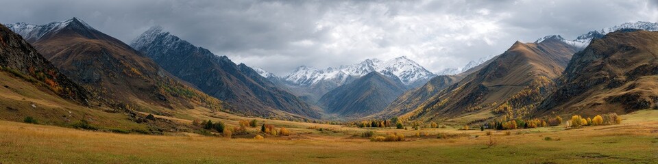 Fototapeta premium Breathtaking Autumn Landscape in the Caucasus Mountains: A Wide Panorama of Nature's Beauty with Vibrant Grass and Clear Sky