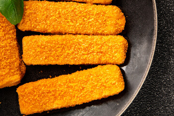Fototapeta premium Fish stick seafood fish mince second course tasty snack fresh delicious gourmet food background on the table rustic food top view copy space pescetarian diet