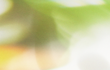 Abstract textured background with vibrant green yellow and grey tones evoking nature and organic patterns