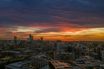 Fototapeta premium Aerial View of Leeds City Skyline at Dawn During a Vibrant Sunrise
