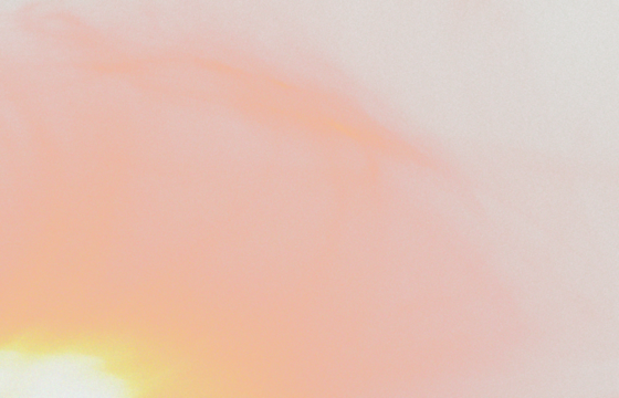 Soft pastel gradient texture featuring gentle transitions of yellow peach pink and gray hues