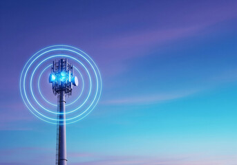 Closeup of a 5G communication tower with blue light signals against a colorful dawn sky with copy space