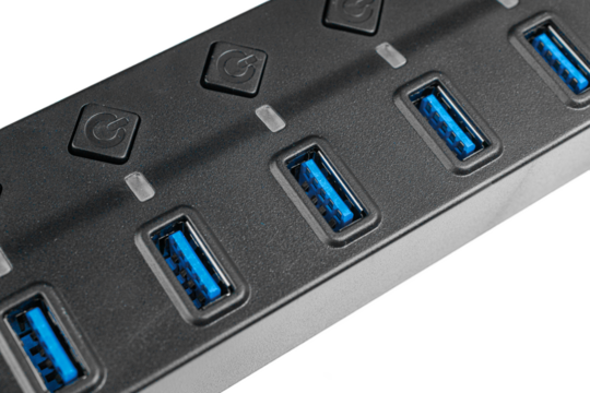 A USB 3.0 7-port hub with power buttons on a white background supports high-speed data. Its efficient design enhances tech device performance.