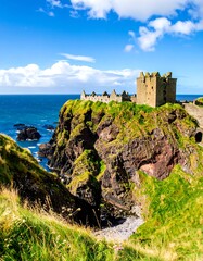 A dramatic coastal landscape showcases a weathered castle perched atop a rugged cliffside overlooking a turquoise ocean.