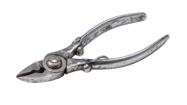 Old, slightly tarnished metal nippers angled to the right