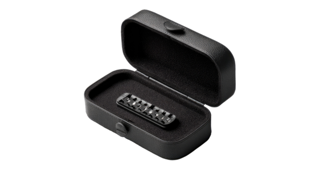 Black guitar bridge in protective case