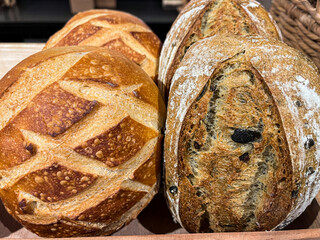 Artisan bread loaves with rustic crust in bakery display