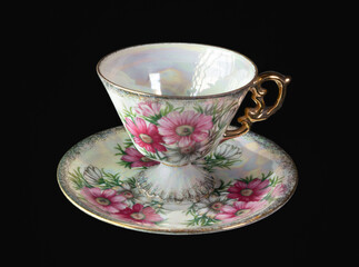 Beautiful tea cup with flowers and gold handle