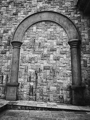 Timeless stone arch on textured wall in Mexico