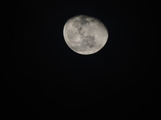 Detailed view of the waxing gibbous Moon against a black sky, showing craters and maria. A sharp, high-contrast astronomical capture.