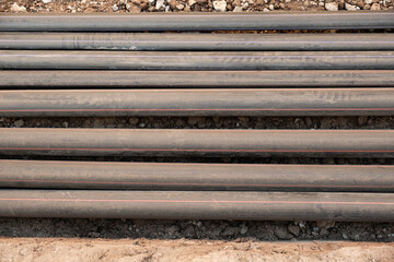 lay multiple communication cables in protective conduits inside an open trench wires remain exposed for inspection and connection infrastructure