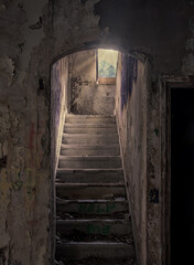 Obraz premium Stairs to the light in an abandoned factory