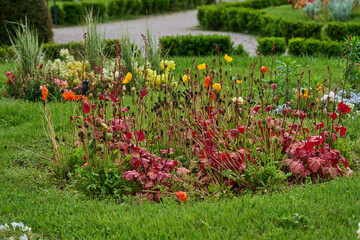 Riva del Garda, Italy - May 8, 2025 - garden in front of the congress center PalaVela during sunny...
