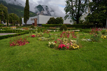 Riva del Garda, Italy - May 8, 2025 - garden in front of the congress center PalaVela during sunny...