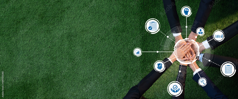 Poster dynamic teamwork scene with hands joining on green grass, surrounded by icons symbolizing business c