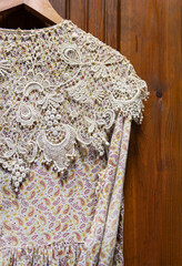 Old-Fashioned Dress with Paisley Print Hangs on Hanger