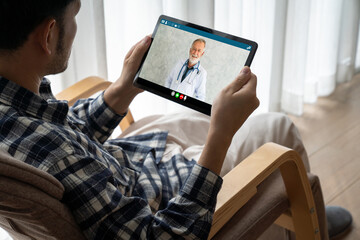 Doctor video call online by modish telemedicine software application for virtual meeting with patient