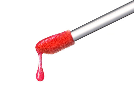 Shimmering pink lip gloss texture dripping down from brush isolated on white background. Smudged cosmetic product smear. Makeup swatch product sample