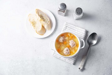 Potato soup with meatballs in a bowl