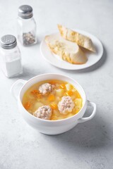 Potato soup with meatballs in a bowl