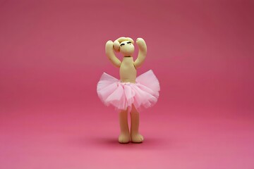 Clay Ballerina in Pink Tutu Against a Pink Background Cute and Whimsical